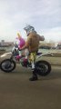 Man Rides Motorcycle with Stuffed Unicorn
