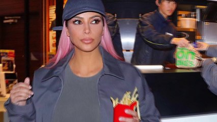 Super size me! Kim Kardashian indulges in a naughty cheat meal as she digs into McDonald's french fries while touring Tokyo.