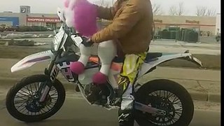 Man On Motorbike Gets Weird With Unicorn In Traffic