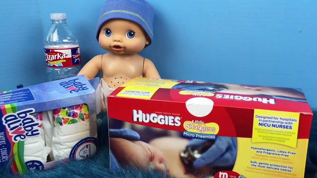Baby Alive Wets n Wiggles Sherlock Pees on me and New Winnie the Pooh Micro Preemie Huggies Diapers