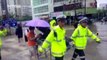Watch: traffic police officers carry patient to hospital in the rain