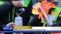 DPRK athletes put up national flag in Olympic village