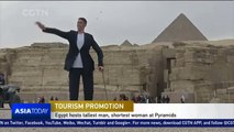 Egypt hosts tallest man and shortest woman at Pyramids to promote tourism