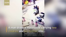 Man drives motorcycle carrying family into sinkhole