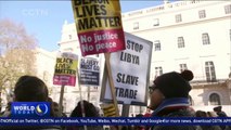 Demonstrators protest against slavery outside the Libyan embassy in London