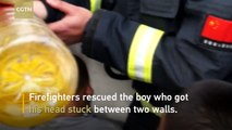 Firefighters rescue boy stuck between walls in east China