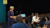 Protester disrupts British PM Theresa May's conference speech