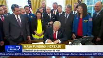 Trump signs NASA funding bill to research sending human to Mars
