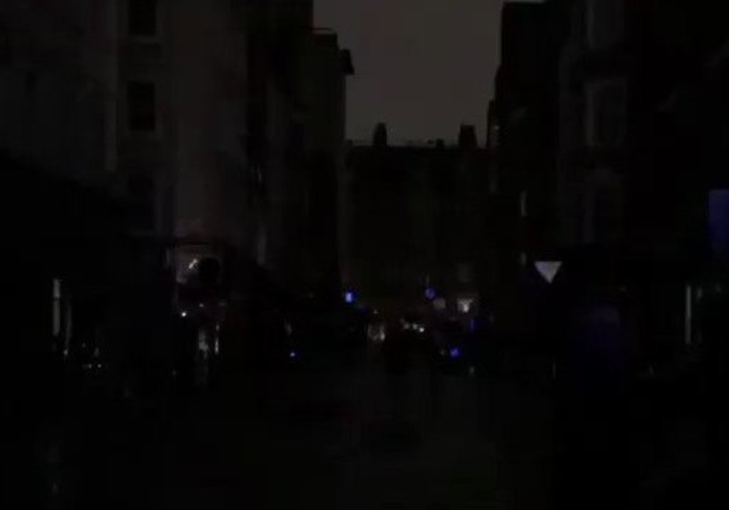Singers Harmonize in Darkness on Frith Street During SoHo Power Outage