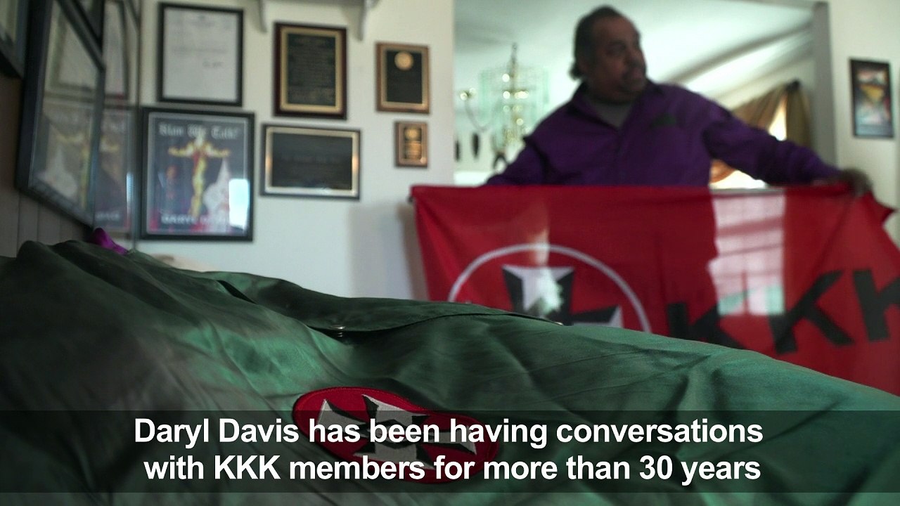 Afro-American blues man has conversations with KKK members