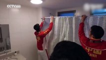 Footage: Chinese athletes fit shower curtain in Olympic Village