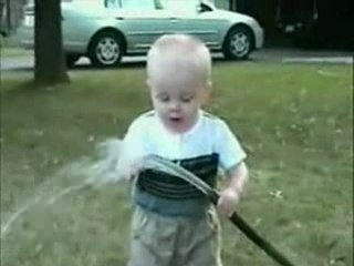 Kid tries to drink from hose