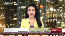 Tens of thousands of Indonesian Muslims march to Jakarta protest against capital's governor