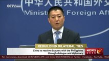 China to resolve the South China Sea disputes with the Philippines through diplomacy