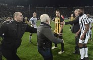 PAOK owner threatens referee while carrying a GUN during pitch invasion