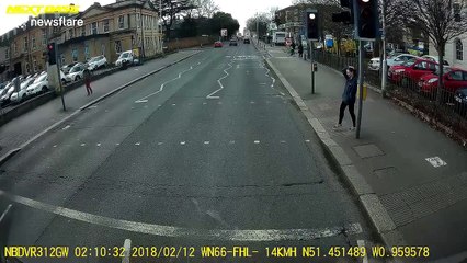 That was close! Driver narrowly misses pedestrian after running red light