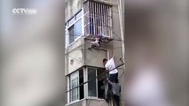 Clutching to life: Chinese boy dangles from 3rd floor for 10 minutes