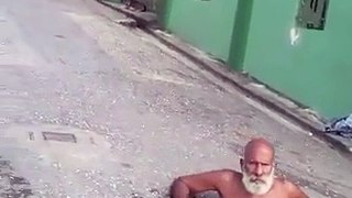 Clever Trinidadian Man Turns A Pothole Into A Jacuzzi & Relaxes In The Middle Of The Road!