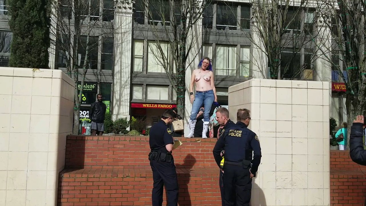 Topless woman activist gets citation from police at Pioneer Courthouse Square - Portland 3-12-18