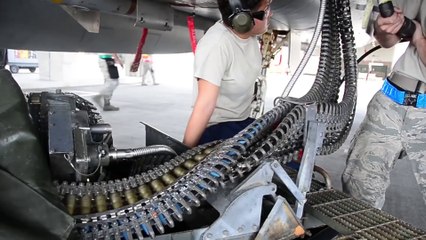 Air Force Weapons Loaders Arm F-15 Fighters
