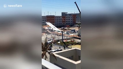 Eyewitness films pedestrian bridge seconds after it had collapsed