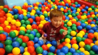 kids play on the playground with balls and slide