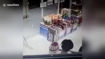 Boy sends motorcycle smashing through glass shopfront