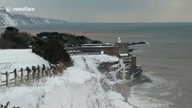 Rare snowfall blankets clifftops of English coastal town of Sidmouth