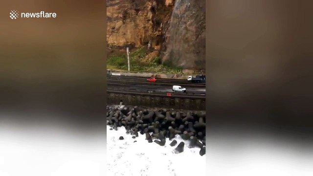 Giant waves invade Reunion Island motorway during tropical cyclone