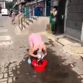 Funny video of Chinese girl take a bath on road - Dailymotion