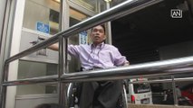 Disabled man breaks glass door in protest of poor train facility