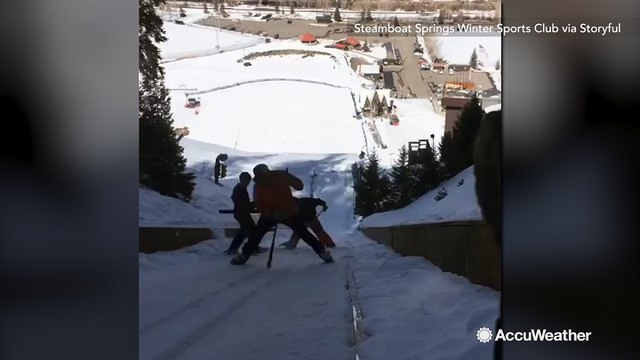 Snow cleared off OIympic Nordic jump