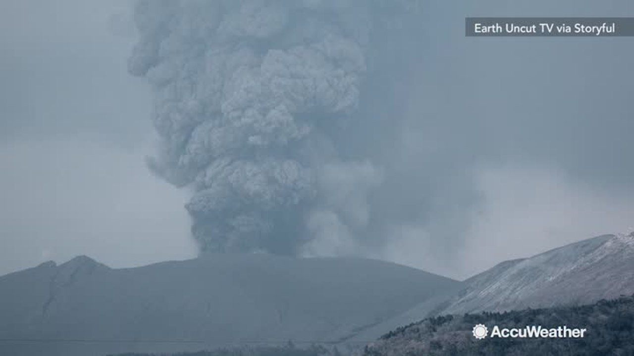 Smoke and ash billow high above Shinmoedake volcano in Japan