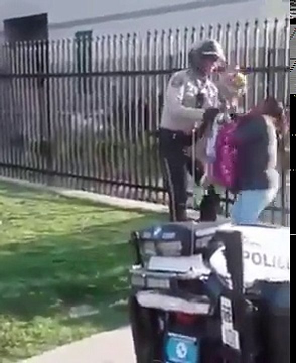 Cop brutally arrests woman for selling flowers