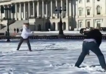 Cory Booker Loses to Jeff Flake in Snowball Duel on Capitol Hill