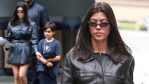 Hell for leather! Kourtney Kardashian is a hot mama in sizzling trench coat dress and matching ankle boots as she steps out with son Mason.