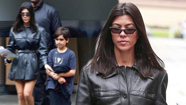 Hell for leather! Kourtney Kardashian is a hot mama in sizzling trench coat dress and matching ankle boots as she steps out with son Mason.