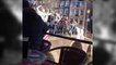 England fans throw beer and a bike into Amsterdam canal