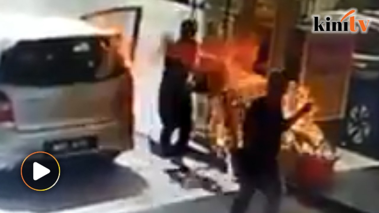 Man panics as petrol pump nozzle catches fire