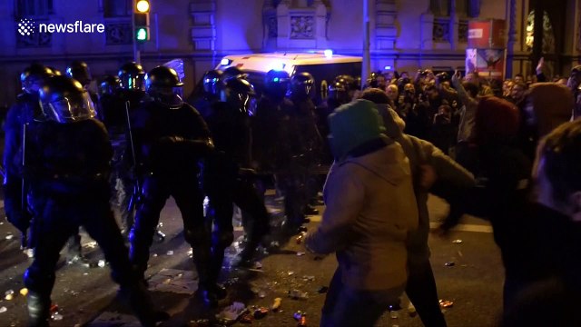 Riot police clash with demonstrators in Barcelona after leader is held