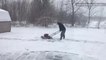 Snowstorm doesn't stop this man from getting some yardwork done