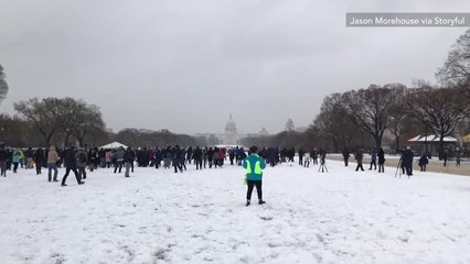 Large crowd gathers for snowball fight on National Mall