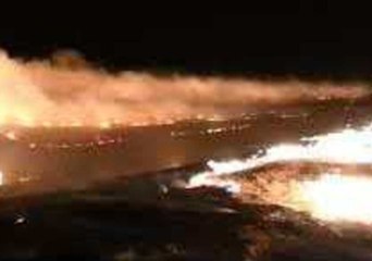 Texas Firefighters Perform Burnout of Large Wildfire