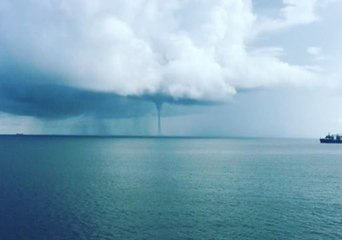 Dramatic Gulf Waterspout Spins Over Still Waters