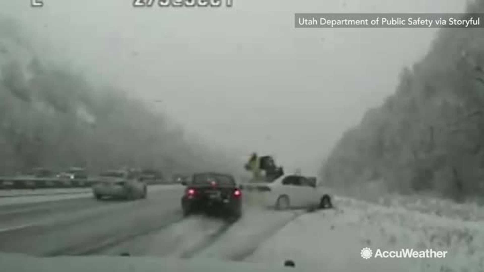 ⁣Dashcam catches car sliding into trooper on snowy Utah highway