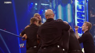 Friday Night SmackDown - Big Show chokeslams Mark Henry through the announce table