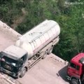 Lorry driver performs the 'scariest U-turn in the world' across a narrow cliff edge...