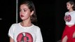 Selena Gomez puts on a VERY leggy display in daring scarlet skirt and vintage t-shirt as she lets her hair down on night out... after showing her support for March For Our Lives.