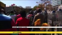 Zimbabwe police break up Harare protests with tear gas & water canon