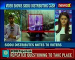 Siddu cash storm: Poll code violation by Karnataka CM; distributes notes to voters